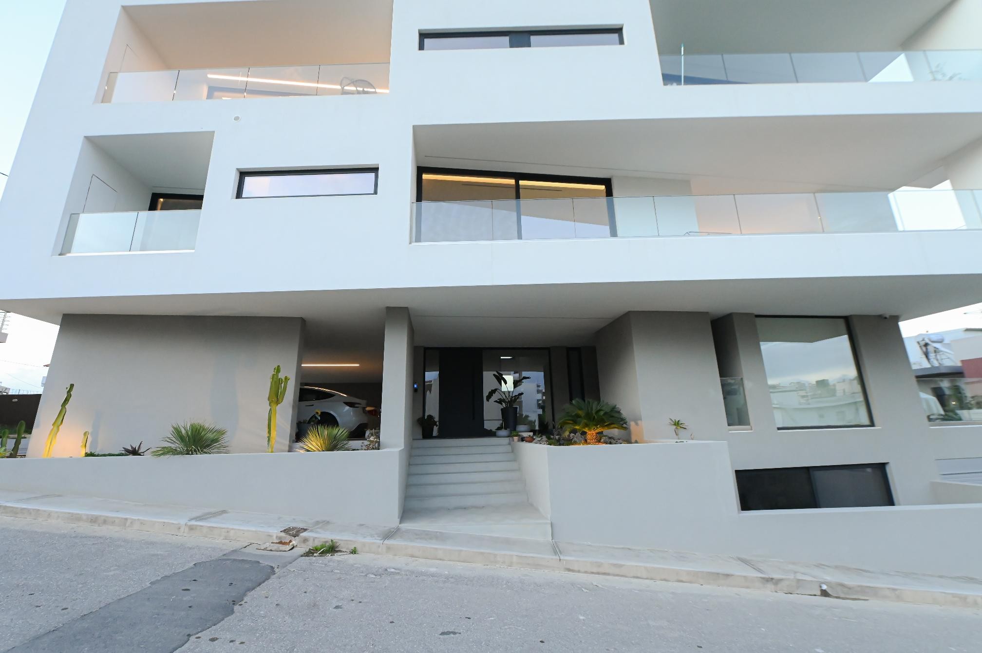 Front facade of KM Living Suites Heraklion with balconies and entrance steps