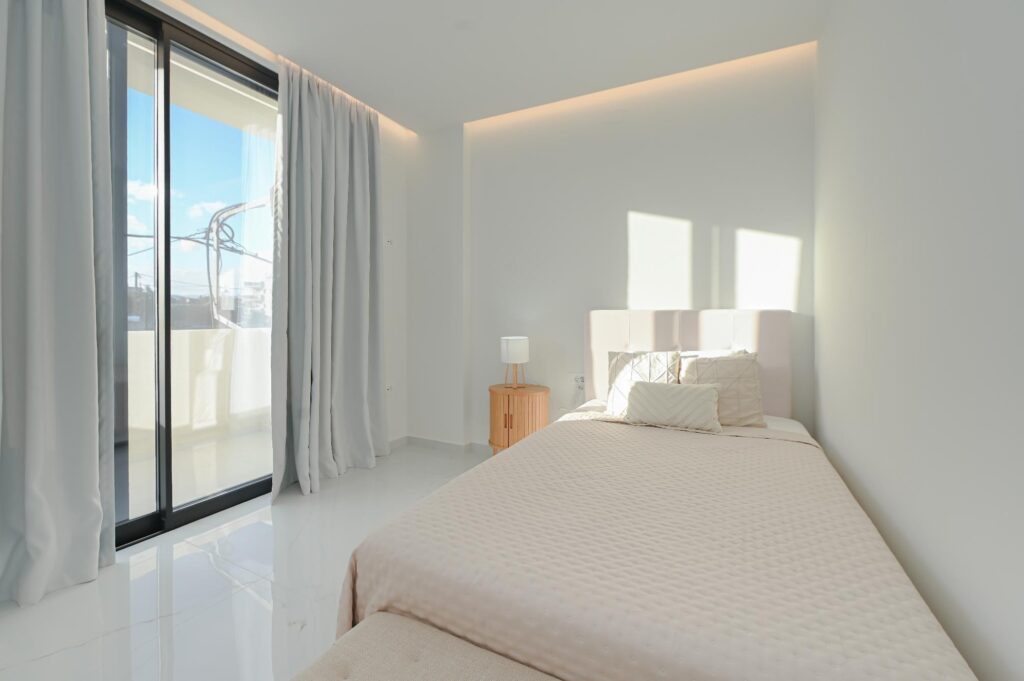 Bedroom with double bed and sliding glass door to the balcony, Executive Deluxe Suite Heraklion